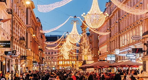 A view down a street in Vienna decorated with Christmas lights
